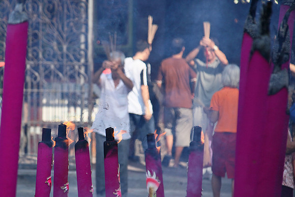 Praying at Guan Yin Temple